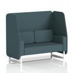 The photo captures a sleek, modern open booth with white legs featuring dynamic polygon panels and a comfortable 2-seater sofa. The custom-made design adds a unique touch to any space.