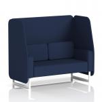 In the photo, a sleek and modern 2-seater open booth with white legs stands tall. The booth features matching alike panels and a comfortable sofa, all upholstered in synergy fabric. Its dynamic design is perfect for any modern space.