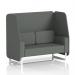 This image features a sleek and modern 2-seater open booth from Dynamic Booths, with white legs and sumi fabric upholstery. The booth also showcases Kobe panels and a complementary sofa in a neutral color. The overall look is contemporary and inviting.