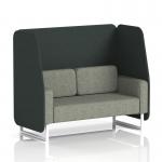 This photo shows a stylish and modern Dynamic Booth in Brixworth design. The 2-seater open booth features sleek white legs and is upholstered in a striking charcoal fabric with rivet details. The panels are a dark, elegant shade of charcoal, while the sofa is finished with a glossy vitreous material.