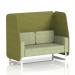 The image shows a dynamic booth with a two seater open design and white legs, custom-made in Brixworth. The booth features olive panels and a burnish sofa in rivet fabric, creating a stylish and modern look.