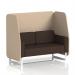 The picture shows a dynamic booth with white legs, made in Brixworth style and featuring the Synergy fabric. The booth includes affix panels and a 2-seater sofa with a wed design.