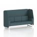 The photo shows a modern 3-seater open booth with sleek white legs, designed to order in Brixworth. Its unique design features polygon panels and a stylish sofa, perfect for a dynamic and contemporary space.