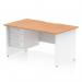 The desk features a sleek, scalloped edge oak top with a white panel end leg. It includes a 3 drawer fixed pedestal for extra storage. The dynamic pedestal desk has ample work space at 1400 x 800mm and adds a modern touch to any office.