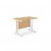 The photograph shows a modern office space with a rectangular desk made of beech wood and white metal legs. The desk measures 1000mm x 600mm and is sleek and stylish, perfect for any contemporary office setting. The clean lines and neutral colors make it a versatile piece of furniture.