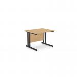 The photograph shows a modern office space with rectangular desks featuring sleek metal legs. The desks have a clean, straight design and are made with a beech-colored finish. The contrast of bright metal against the warm wood creates a professional and stylish work environment.