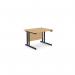 The photograph shows a modern office space with rectangular desks featuring sleek metal legs. The desks have a clean, straight design and are made with a beech-colored finish. The contrast of bright metal against the warm wood creates a professional and stylish work environment.