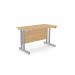 The image shows a sleek, modern office setup with two rectangular desks made of ashford twin bar metal legs. The desks measure 1200mm x 600mm and are a straight design. The desks have a beech finish and are accompanied by a SLV ATW-CTST1260/BE/SLV.