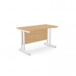 The photo shows a modern office space with sleek, rectangular beech desks featuring twin bar metal legs. The design is clean and minimalist, creating a professional and organized work environment. The desks measure 1200mm x 600mm and are perfect for any office setting.