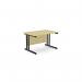 The image displays a sleek and modern office setting featuring two rectangular desks with ashford twin bar metal legs, each measuring 1200mm x 800mm. The straight desks are finished in a natural maple color and accented with black details for a professional touch.