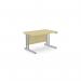 This photo shows a modern office space with sleek rectangular desks in a maple finish. The desks are supported by silver metal legs and measure 1200mm x 800mm. The minimalist design and clean lines make for a professional and functional workspace.