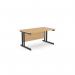 This photo features an office setting with modern, rectangular desks. The desks have Ashford twin bar metal legs and measure 1400mm x 800mm. They have a straight design and are finished in a natural beech color with black accents.