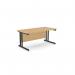 The photo shows a sleek and professional office space with two rectangular desks made of beech wood and supported by sturdy metal legs. The desks measure 1600mm x 800mm and are perfect for any modern workplace. The clean lines and simple design add a touch of elegance to the room.
