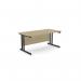 The picture shows a sleek and modern office space with two ashford twin bar metal leg desks. The desks are rectangular and measure 1600mm x 800mm, featuring a straight design for easy placement. The desks are finished in urban oak and black for a stylish look.