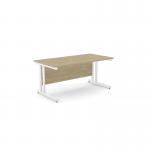 This photo features a modern office space with sleek, rectangular desks. The desks are made with Urban Oak wood and supported by clean-lined metal legs. The 1600mm x 800mm size provides ample workspace for productivity.