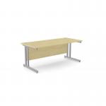 The photo features a modern office space with sleek, rectangular ashford twin bar metal leg desks. The desks are 1800mm x 800mm in size and have a maple finish with silver metal legs. The open concept design and clean lines add a touch of sophistication to the workspace.