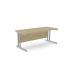 The image shows a spacious office set-up with sleek, rectangular desks made of urban oak. The sturdy metal legs add a modern touch to the overall design.
