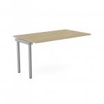 This photograph showcases a modern and functional office bench desk with sleek add on units. The urban oak finish adds a touch of sophistication while the silver accents bring out a contemporary vibe. Narrow design with wide portal top offers ample workspace for one person.