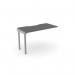 The photograph shows a sleek office bench desk with add-on units, featuring a scalloped top in graphite silver. The compact design comfortably fits one person and provides ample desk space at 1000 x 600. A modern addition to any workspace.