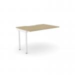 The image shows an edit office bench desk with add on units in urban oak and white. The C-sense 1 person bench add-on features a scallop top and measures 1000 x 800. It has a modern, sleek design that would fit in any office space.