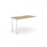 A sleek, modern office setup with wooden desk add-on units, scallop top design and a clean white finish. The desk comfortably accommodates one person and provides ample space for work and organization. The urban oak finish adds a touch of warmth to the workspace.
