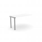 This image shows a sleek, modern office bench desk with C-sense add-on units. The clean white surface is complemented by a scallop top design and a silver frame, creating a professional and contemporary look. The desk is ideal for a single person, with dimensions of 1200 x 600.