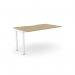 This photo shows a sleek and modern office bench desk with add-on units. The desk features a scalloped top and measures 1400 x 800mm. The color is Urban Oak with white accents, creating a stylish and professional workspace.