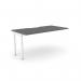 The photograph shows a modern and sleek office bench desk with add-on units attached. The desk features a scallop-shaped top and is finished in a stylish graphite and white color scheme. It comfortably accommodates one person and measures 1600 x 800 in size.