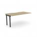 This photograph features a sleek and modern office bench desk, with add-on units and a scallop top measuring 1600 x 800. The desk is finished in urban oak and black, creating a stylish and professional workspace for one person.