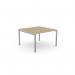 In this image, we see a modern office bench desking setup with C-sense design. The setup includes an open leg bench, topped with a portal for easy cable management. The desk measures 1000 x 600mm and features an urban oak finish with silver accents.