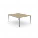 In the photo, there is a modern office bench desking system called C-sense, designed for one person. The open leg design and portal top provide a spacious and functional work area. The dimensions are 1000 x 800, and the color is Urban Oak with a silver finish.