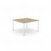 The photograph captures a sleek and modern office bench desking setup. The C-sense 1 person bench features an open leg design and a scallop top surface measuring 1000 x 600. The urban oak and white color combination adds a sophisticated touch to any workspace.