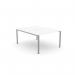 The picture captures a sleek and modern office bench with open legs and a scallop-shaped top. The dimensions measure 1000 x 800 and the color is a crisp white with silver accents. The clean and minimalist design adds a professional touch to any workspace.