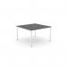The image shows a modern office bench desking setup with an open leg design and a unique scalloped top. The sleek graphite finish is accented by a clean white top, creating a stylish and professional workspace for one person.