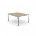 The picture shows a modern office bench desking set-up with an open leg design and a scallop top in Urban Oak finish. It comfortably accommodates one person and measures 1200 x 800. The sleek look is completed with a silver accents.