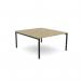 In the photograph, a sleek and modern open-leg bench desk is seen in an urban oak finish. The scallop top adds a touch of sophistication to the 1400 x 800 size, making it perfect for a single persons workspace.