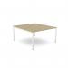 This image shows a sleek, modern office bench desking set-up with an open leg design. The scalloped top adds a touch of elegance to the 1400 x 800 size, while the urban oak finish gives it a natural, urban feel. The white accents add a pop of brightness to the overall look.