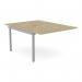 The photograph shows an urban oak desk with add-on units for a C-sense 2 person bench. The scallop top measures at 1200 x 800 and is sleekly designed with a silvery finish. Perfect for any modern office space.