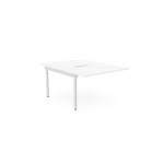 The image captures an office workspace with a 2 person C-sense bench desk, adorned with add-on units in a sleek white finish. The scalloped top adds a touch of design while the 1200 x 800 size allows for ample room to work.