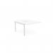 The image captures an office workspace with a 2 person C-sense bench desk, adorned with add-on units in a sleek white finish. The scalloped top adds a touch of design while the 1200 x 800 size allows for ample room to work.