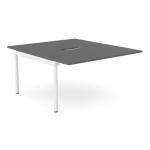 This image features a sleek graphite desk with scalloped edges, paired with two white office bench add-on units. The versatile C-sense desk is perfect for a dynamic working environment, accommodating two persons with ample desk space.