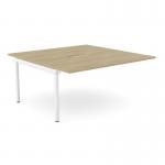 This photo showcases an urban oak and white C-sense two-person bench add-on with a scallop top, measuring 1600 x 800. The desk is suitable for use in an office, with additional units that can be added as needed. The clean, modern design is both functional and stylish.