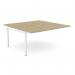 This photo showcases an urban oak and white C-sense two-person bench add-on with a scallop top, measuring 1600 x 800. The desk is suitable for use in an office, with additional units that can be added as needed. The clean, modern design is both functional and stylish.