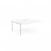 This image shows a clean and efficient office desk setup with two C-sense bench desks, connected by an add-on unit with scallop top. The white color adds a touch of modernity to the space. The desks measure 1600 x 800, making it suitable for two people to work comfortably.