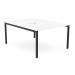 This photo showcases a modern office bench desking setup with an open-leg design and a scallop top. The white and black color scheme adds a clean and professional touch to any workspace. With enough space for two people, this 1200x800 desk is perfect for collaboration and productivity.