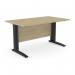 In this photo, a modern office setting is shown with rectangular desks made from Komo metal legs and adorned with a sleek urban oak finish. The desks measure 1400mm x 800mm and feature a straight design, providing a clean and efficient work space. The black accents add a touch of sophistication to the overall look.