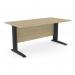 This photo captures a sleek and modern office space with rectangle desks featuring sturdy metal legs. The desk measures 1600mm x 800mm and is finished in stylish urban oak, paired with sleek black accents for a sophisticated look.