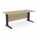 In the image, there are three rectangular desks in an office setting. The desks have a metal leg design and measure 1800mm by 800mm. They are finished in an urban oak color with black accents.