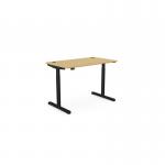 The photograph shows a round, curved bamboo top desk with a black frame. It is an adjustable height desk, with the dimensions 1200 x 700mm. It is designed for use in an office setting, allowing for both sitting and standing positions.