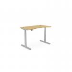 The image shows a modern office set up with a round Sit Stand and Height Adjustable Desk. The desk has a curved Bamboo top and a sleek Silver frame. Perfect for a stylish and ergonomic workspace.